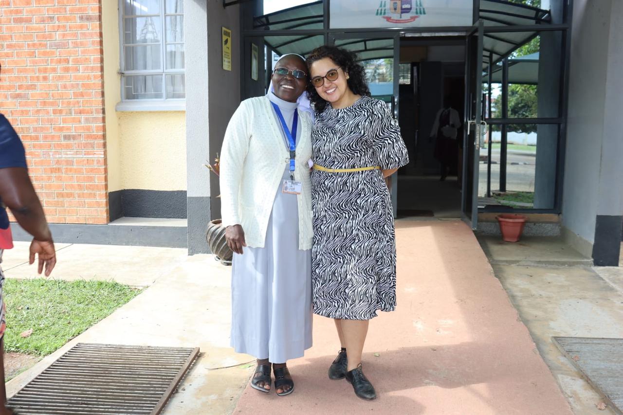 Two visitors together outside the Diocesan Secretariat