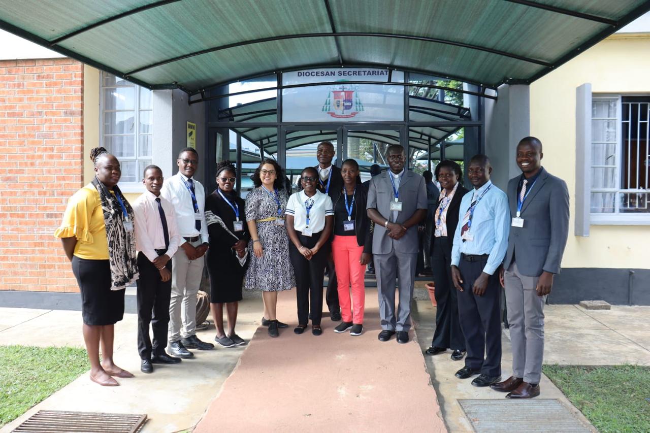 A group gathered outside the Diocesan Secretariat in Kakamega